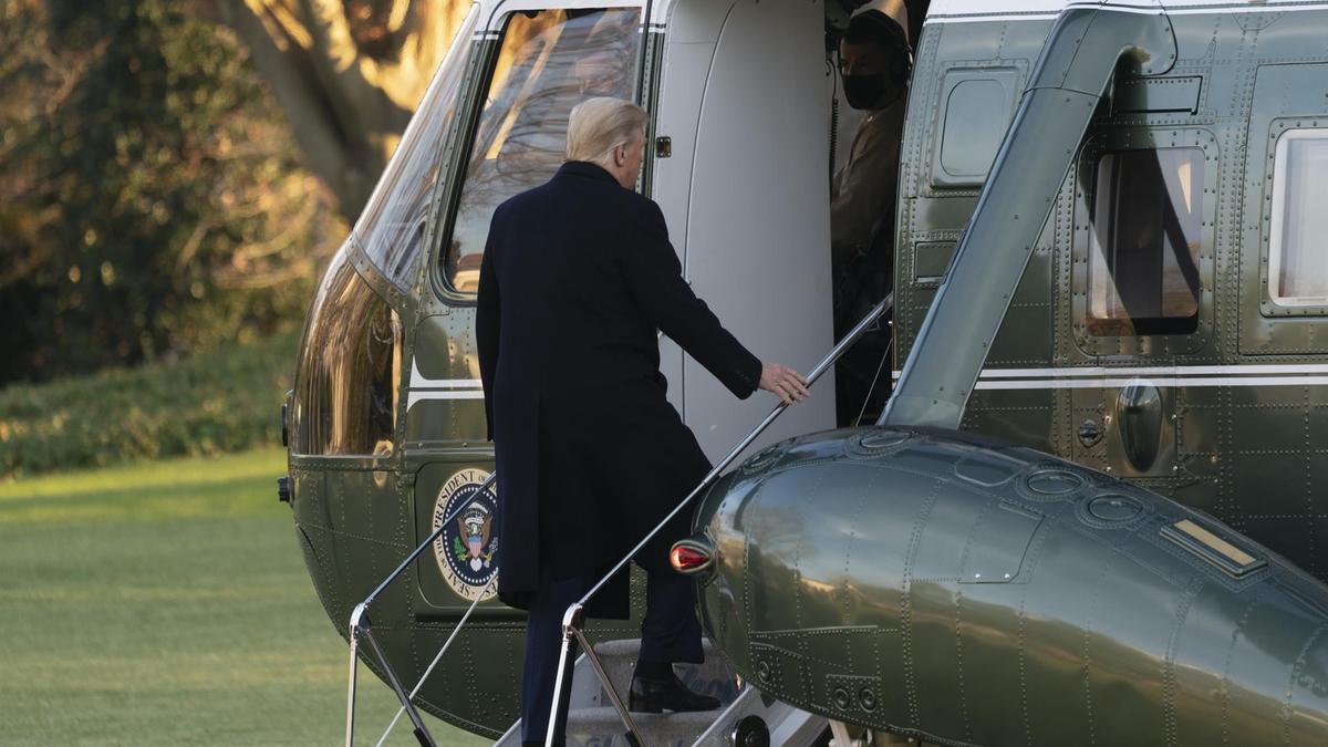 US President Donald Trump boards Marine One on his way to Florida for the holiday, before he released another list of pardons. Bloomberg