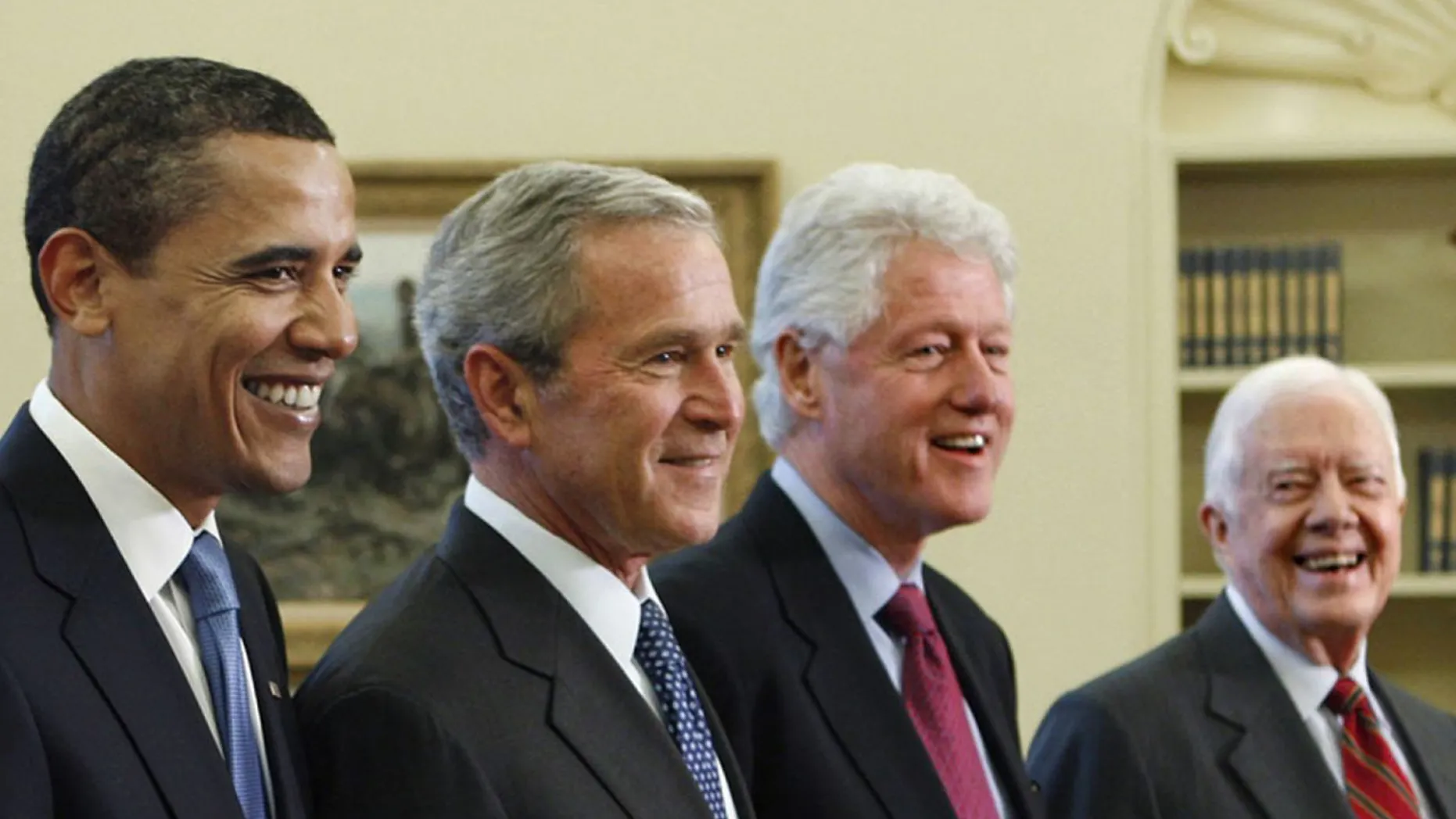 Former Presidents Barack Obama, George W. Bush, Bill Clinton, and Jimmy Carter, pose in the Oval Office of the White House. (AP Photo/J. Scott Applewhite)