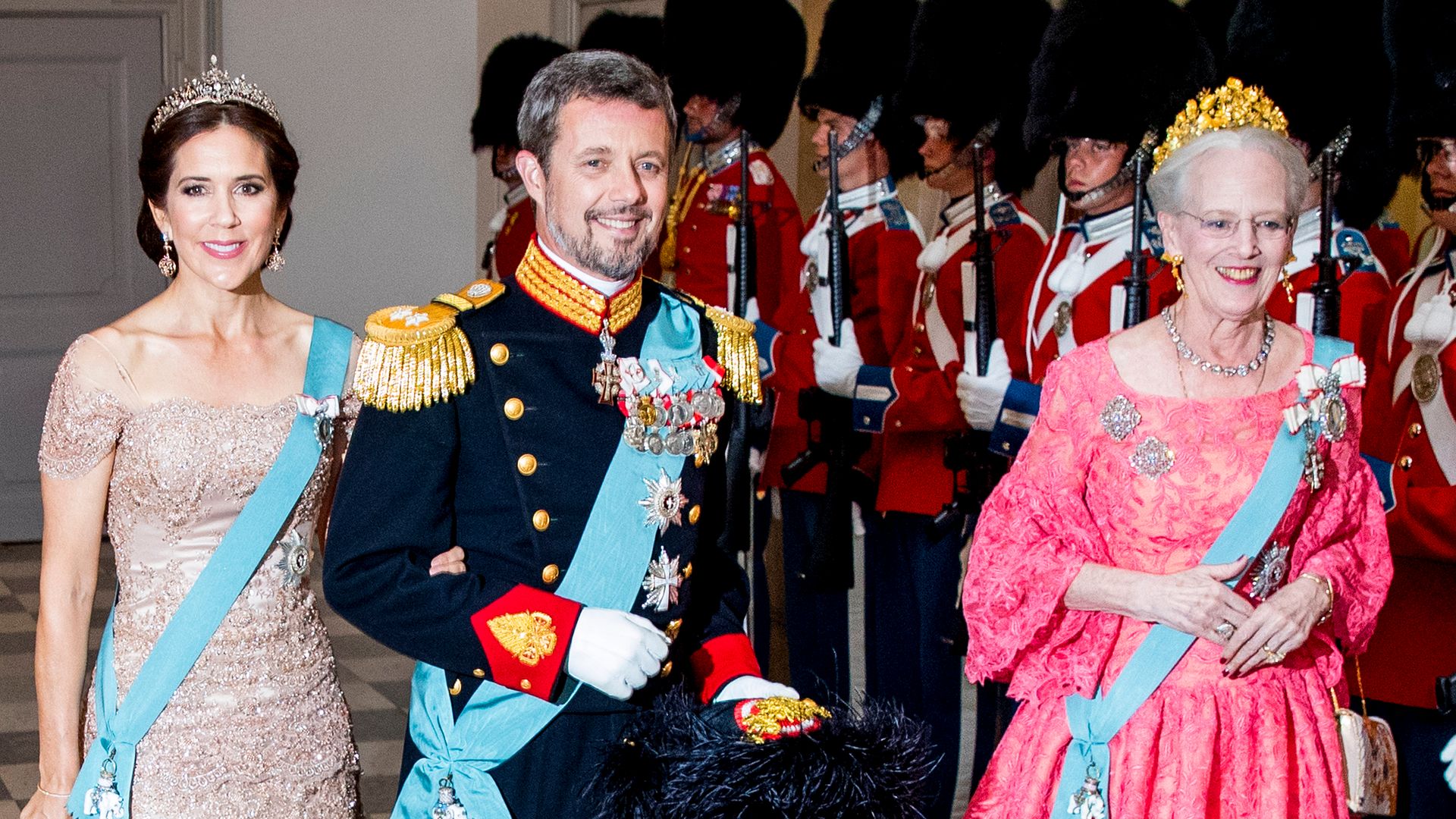 The guest of honor, Crown Prince Frederik, arrives with Crown Princess Mary and Queen Margrethe of Denmark.