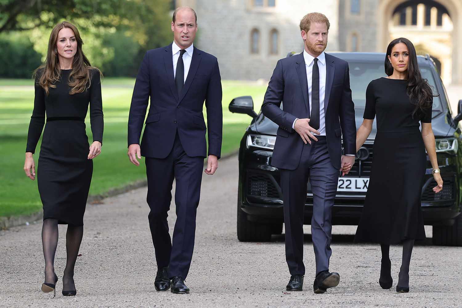 Britain's Catherine, Princess of Wales, Britain's Prince William, Prince of Wales, Britain's Prince Harry, Duke of Sussex, and Meghan, Duchess of Sussex on the long Walk at Windsor Castle on September 10, 2022, before meeting well-wishers.
