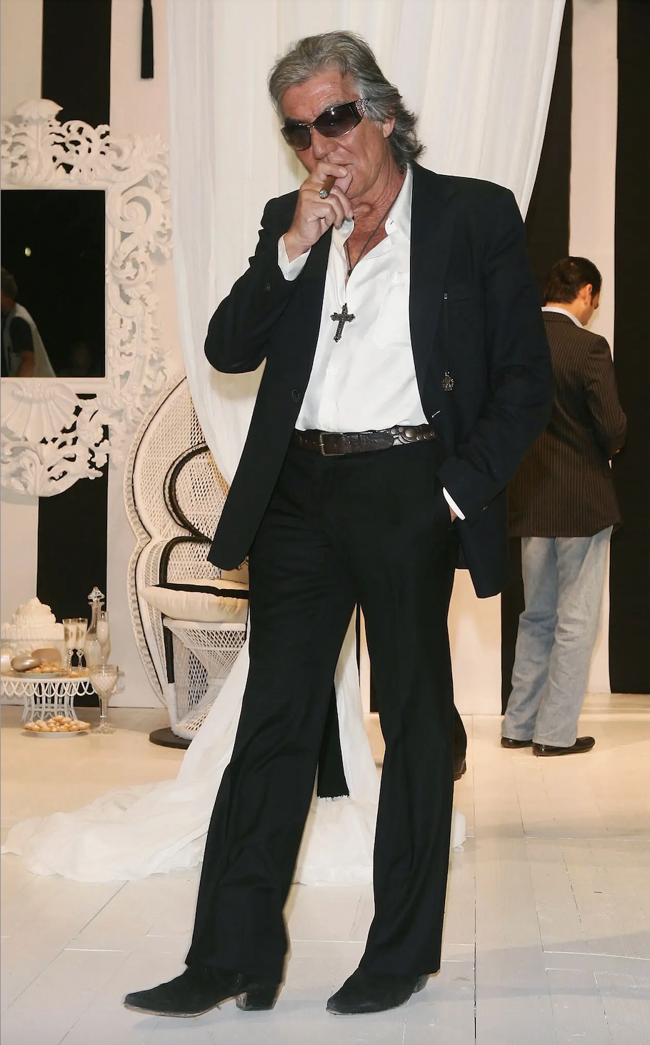 Mr. Cavalli in 2006. Permanently bronzed and forever puffing on a cigar, he pursued a lifestyle that was as rock ’n’ roll as his clothes.Credit...Pascal Le Segretain/Getty Images