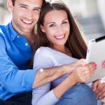 Young couple with digital tablet