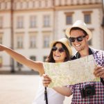 Happy tourist sightseeing city with map