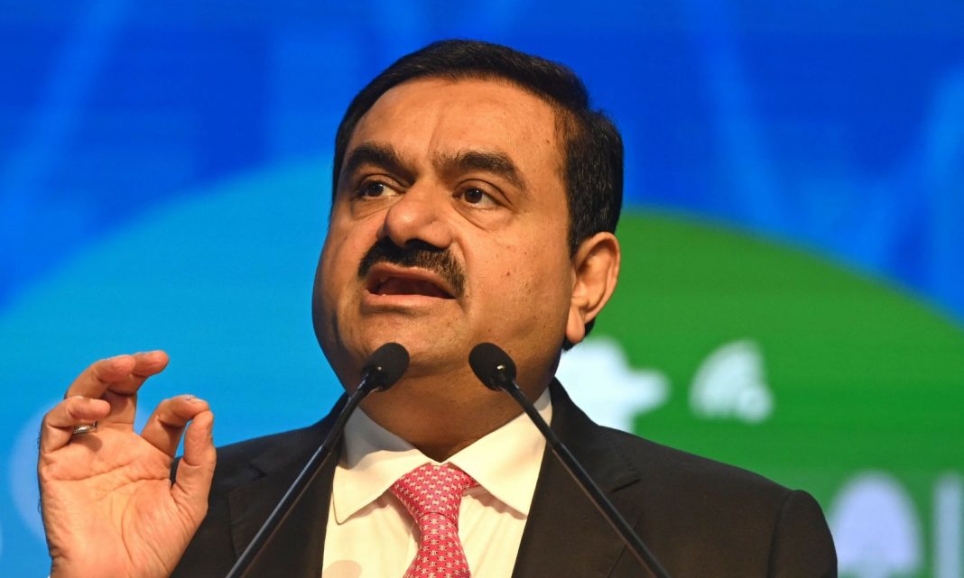 market value, Chairperson of Indian conglomerate Adani Group, Gautam Adani, speaks at the World Congress of Accountants in Mumbai. | AFP