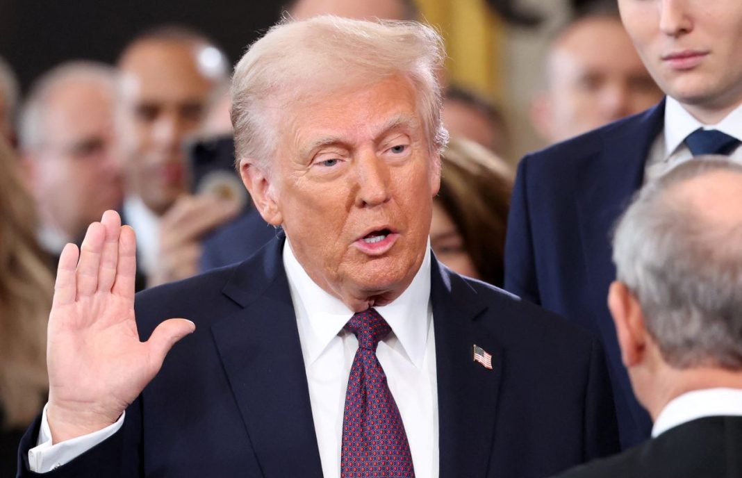 Donald Trump takes the oath of office during his inauguration in Washington, DC on Monday, January 20, 2025. | Kevin Lamarque/Reuters