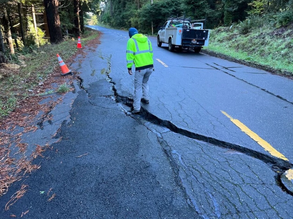 aftershocks, A crack is seen on Blue Slide Road in Rio Dell, California, following a 7.0-magnitude earthquake, Dec. 5, 2024.