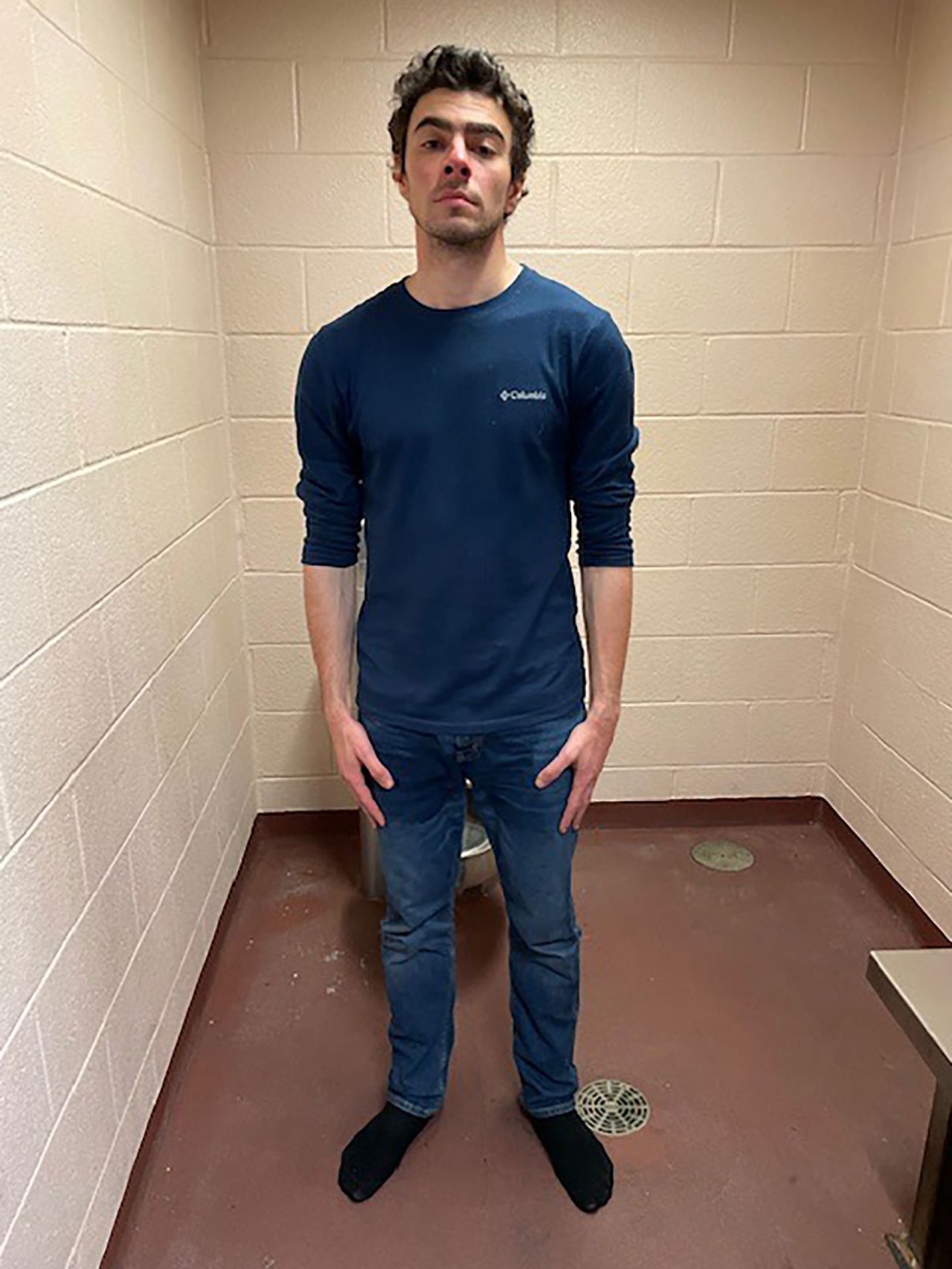 In this handout photo released by the Altoona Police Department, Luigi Mangione is seen in a holding cell after being taken into custody on Monday, December 9, in Altoona, Pennsylvania. | Altoona Police Department/Getty Images