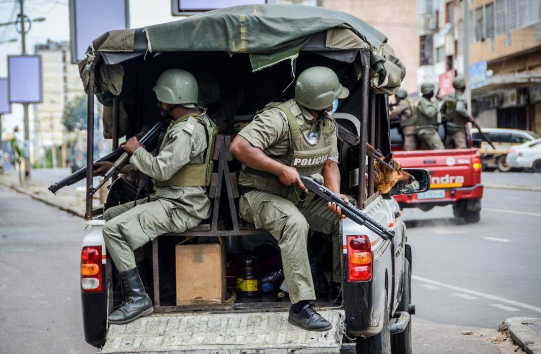Prison Break, Police officers are seen in a patrol vehicle in the capital of Mozambique's, Maputo. | Carlos Uqueio/AP/File photo