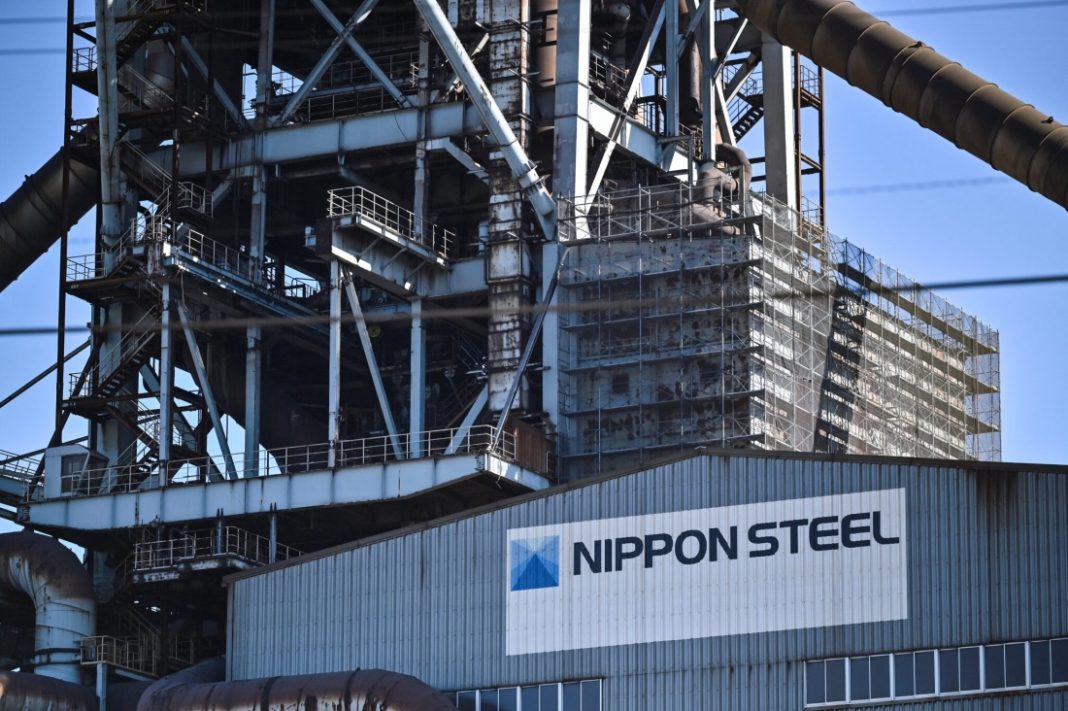 This photo shows signage on the exterior of a blast furnace building during a media tour by Japanese company Nippon Steel at their East Nippon Works Kashima Area facility in Kashima, Ibaraki prefecture, north of Tokyo on December 6, 2024. – US President Joe Biden on January 3, 2025, announced he has blocked the controversial $14.9 billion sale of US Steel to Japan’s Nippon Steel, citing a strategic need to protect domestic industry. | Richard A. Brooks/AFP
