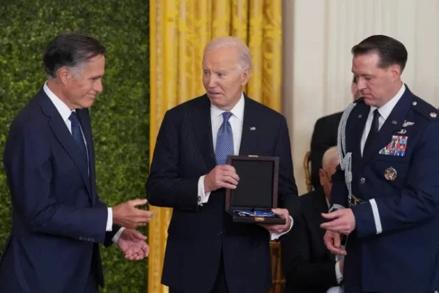 George W. Romney was awarded the Presidential Medal of Freedom posthumously by Biden on January 4, 2025. Mitt Romney accepted the honor on behalf of his late father. | AFP via Getty Images