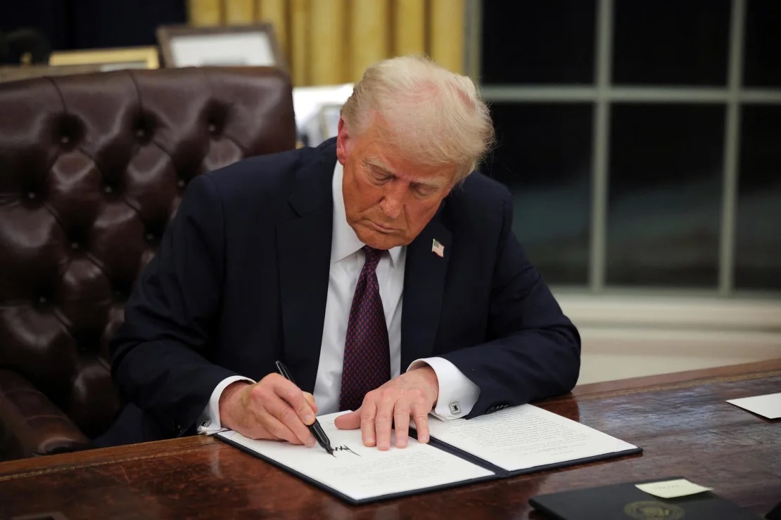 international students, 43 countries, Travel Ban, President Donald Trump signs documents as he issues executive orders and pardons for January 6 defendants in the Oval Office at the White House on Inauguration Day in Washington, DC, on January 20. Since then one of the orders he signed rescinded a 1965 order banning employment discrimination by government contractors.