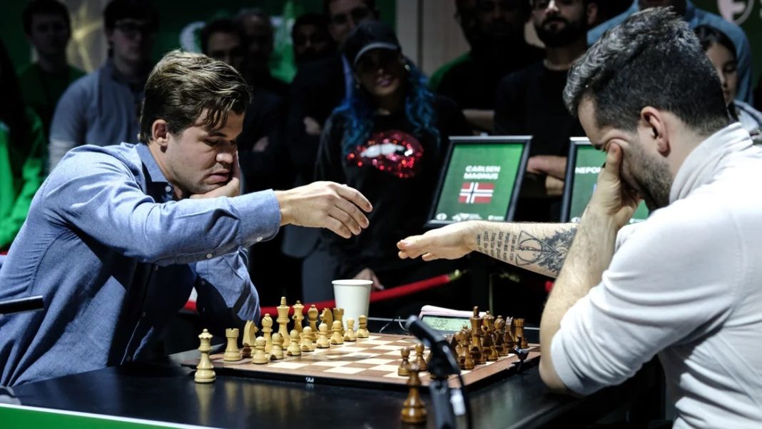 World Blitz , Carlsen and Nepomniachtchi prepare to play in the World Blitz Chess Championship final on Tuesday, December 31, 2024. | Misha Friedman/Getty Images