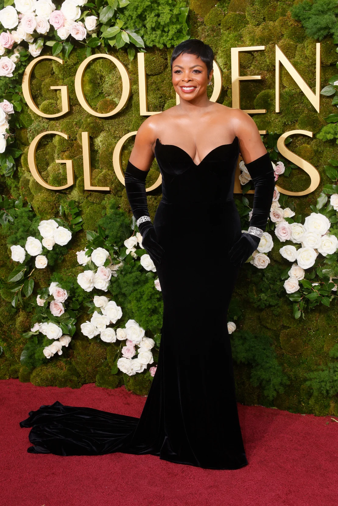 Janelle James in custom Christian Siriano velvet dress. Etienne Laurent/AFP/Getty Images