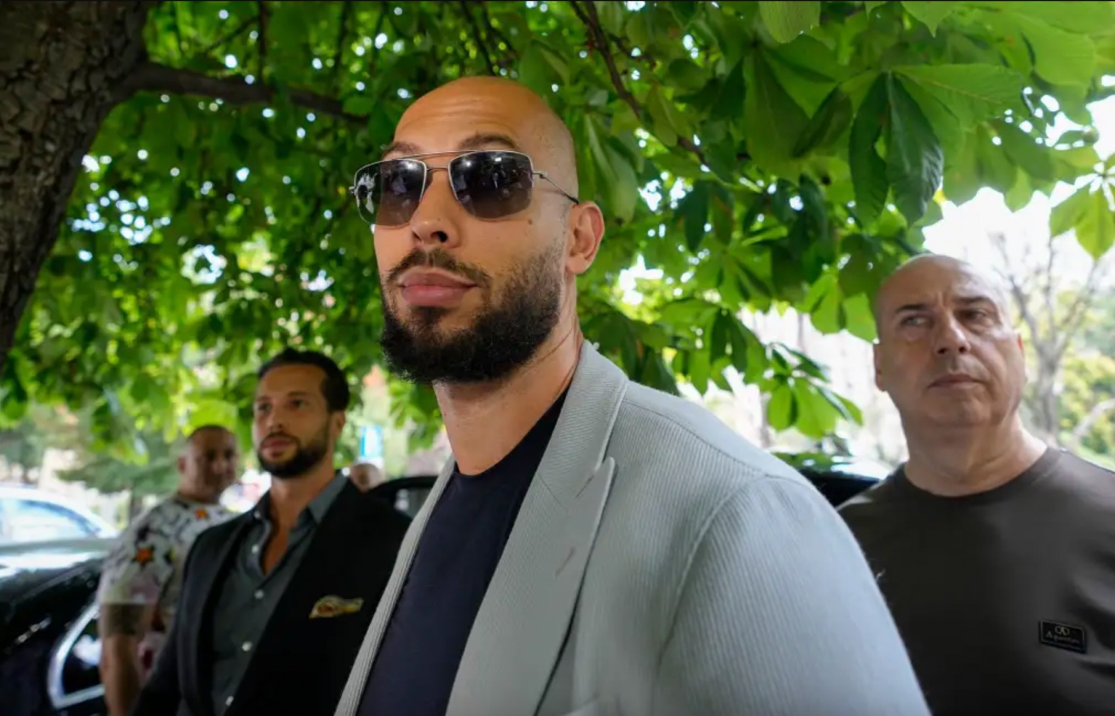 Andrew Tate leaves the Court of Appeal along with his brother Tristan, left, in Bucharest, Romania, Tuesday, August 1, 2023. | Andreea Alexandru/AP