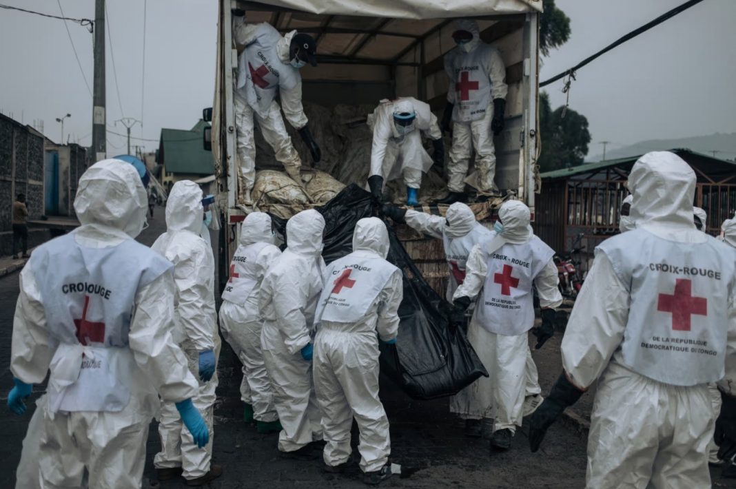 female prisoners, DRC, Members of the Congolese Red Cross unload the bodies of victims of the recent clashes for burial in a cemetery in Goma in the first week of February 2025. | Alexis Huguet/AFP/Getty Images