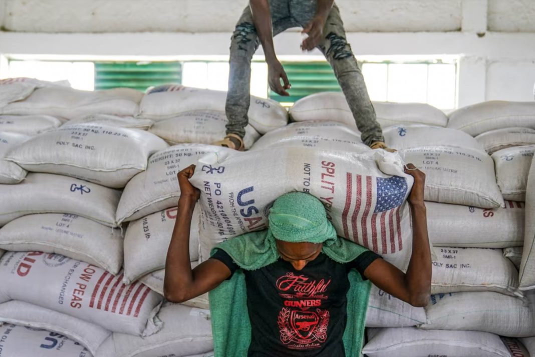 Iran War, Aid workers move bags of USAD lentils in Ethiopia in 2021. | Jemal Countess/Getty Images file