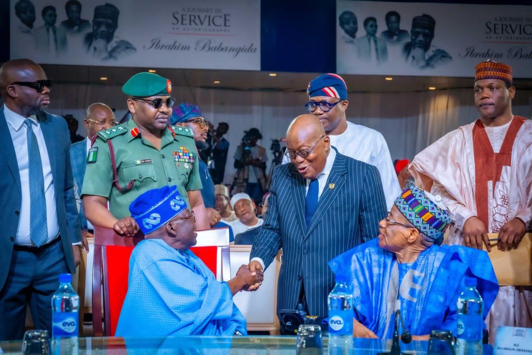 former Military, military, Presidential Library, President Bola Tinubu (left) of Nigeria is greeted by former Ghanaian President Nana Akufo-Addo, as former Nigerian Head of State, General Ibrahim Babangida (Rtd.) looks on at the book launch of “A Journey in Service”, autobiography of ex-Military President Ibrahim Badamasi Babangida (IBB) held at Transcorp Hilton Hotel, Abuja, on Thursday, February 20, 2025.