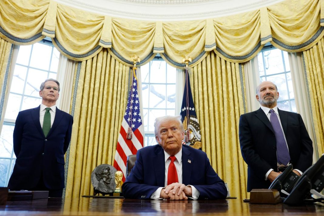 tariffs, Canada, Secretary of Treasury Scott Bessent and Howard Lutnick stand behind President Donald Trump as he speaks to reporters in the Oval Office of the White House on February 3, in Washington, DC. Anna Moneymaker/Getty Images
