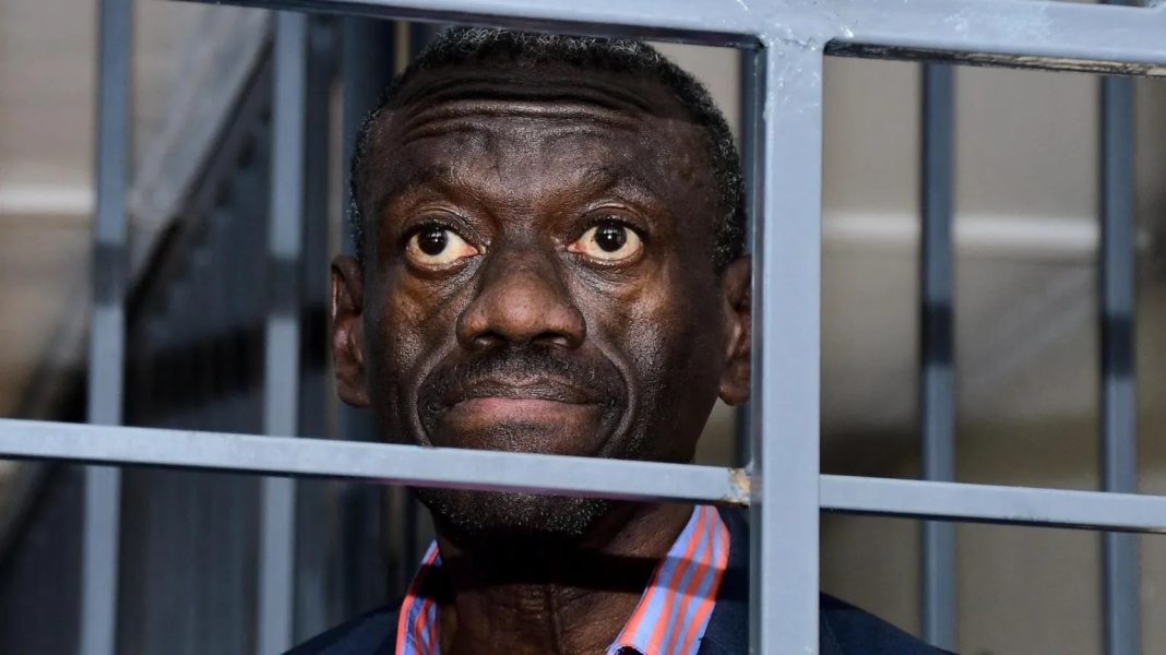 Detained Ugandan opposition leader Kizza Besigye pictured behind bars in prison. | Reuters