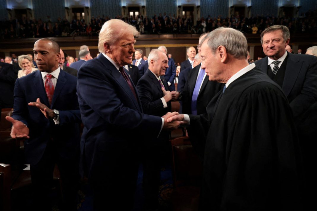 Left: President Donald Trump greets Chief Justice of the United States John G. Roberts as he arrives to deliver an address to a joint session of Congress at the U.S. Capitol on March 4, 2025. Photo by Win McNamee/ Pool via REUTERS