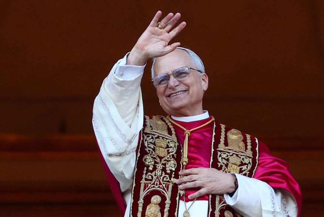 Newly elected Pope Leo XIV waves from the balcony of St. Peter's Basilica on Thursday. Guglielmo Mangiapane/Reuters