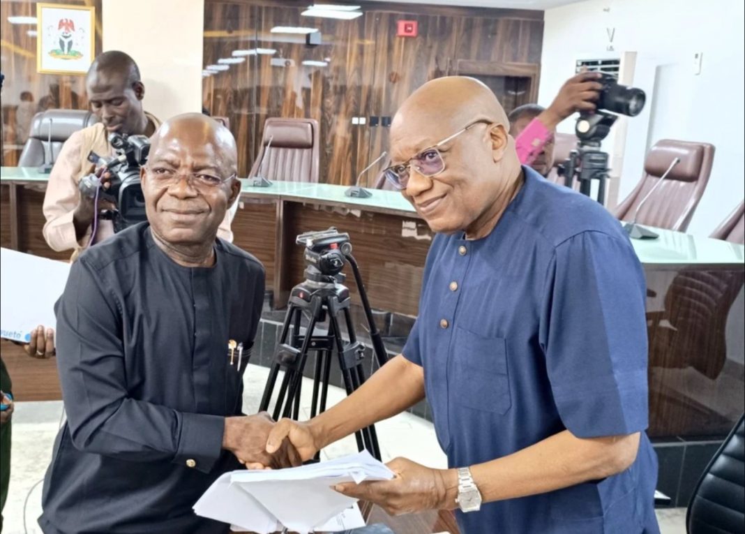 Governor Alex Otti presenting Certified True Copy of the Supreme Court judgement on Labour Party leadership to Sam Olumekun, the acting Chairman of the Independent National Electoral Commission (INEC) on Wednesday, April 9, 2025