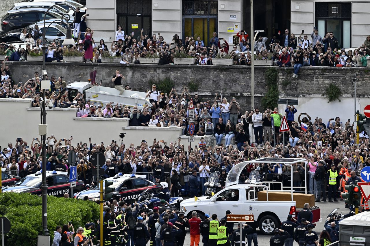 People gather along the road as the coffin of late Pope Francis is transported from St Peter's Basilica to Santa Maria Maggiore Basilica. Antonio Masiello/Getty Images