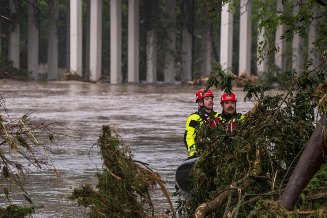 Trees emerge from flood waters along the Guadalupe River on July 4, 2025 in Kerrville, Texas. Heavy rainfall caused flooding along the Guadalupe River in central Texas with multiple fatalities reported. Eric Vryn/Getty Images/AFP