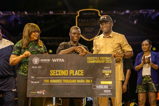 Lukman Muhammad, second-place winner in the men’s category, is presented with his ₦500,000 prize by His Excellency Comrade Philip Shaibu, Director-General of the National Institute of Sports, and Aisha Falode, Executive Committee Member of the Nigeria Football Federation (NFF) and FIFA Media and Communications Committee Member, during the Predator Energy Freestyle Football Championship 2025, held at Ikeja City Mall in Lagos on Saturday, October 18, 2025. | Alexis Photos/FNT