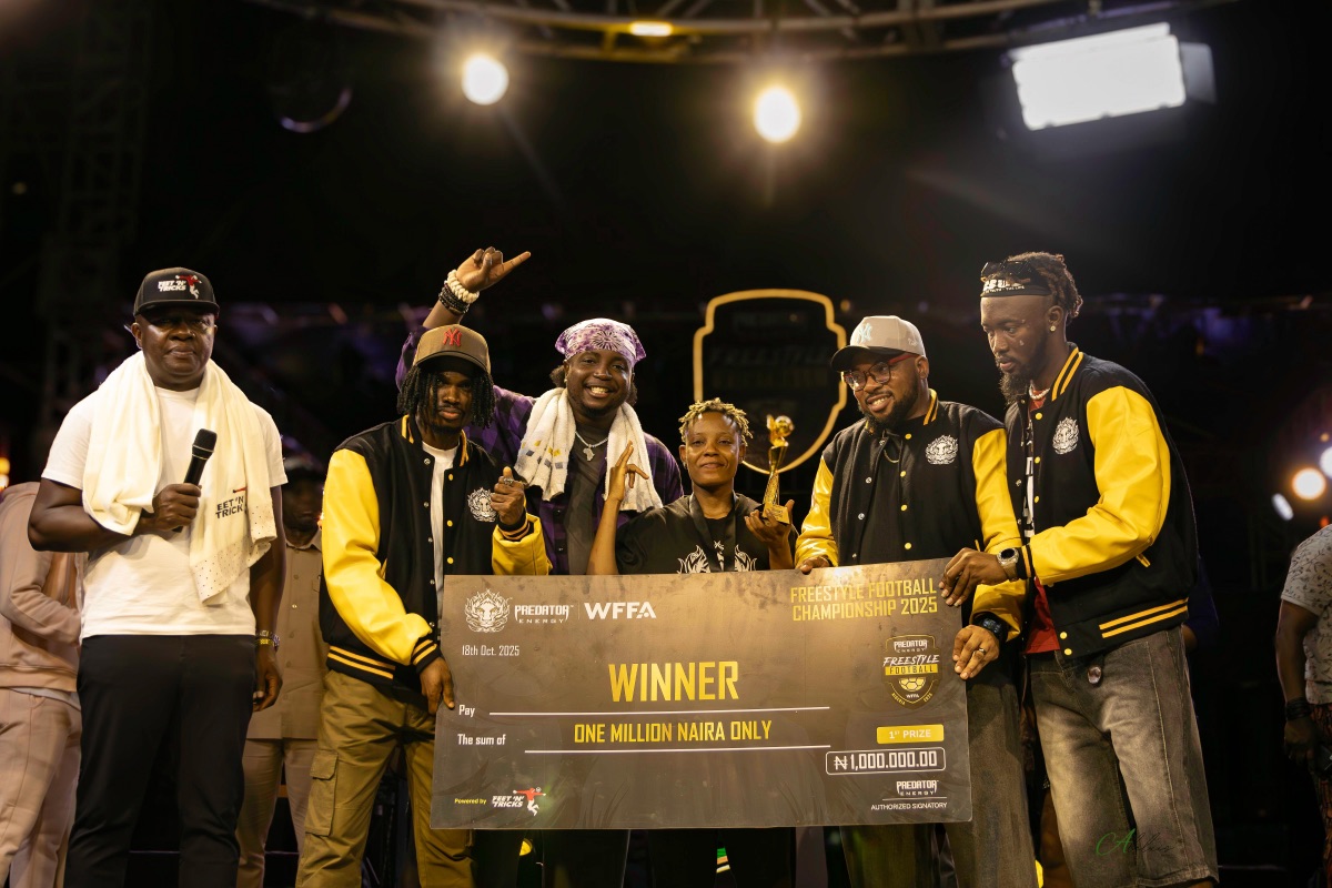 Evelyn Okafor (centre), winner of the women’s category, receives her ₦1 million prize at the Predator Energy Freestyle Football Championship 2025, held at Ikeja City Mall in Lagos on Saturday, October 18, 2025. To her left is Valentine Ozigbo, Chairman of Feet ’ N’ Tricks International, alongside representatives of influencer teams Fanstribe, Talkfooty, and Ultimate Kombo. | Alelxis Photos/FNT