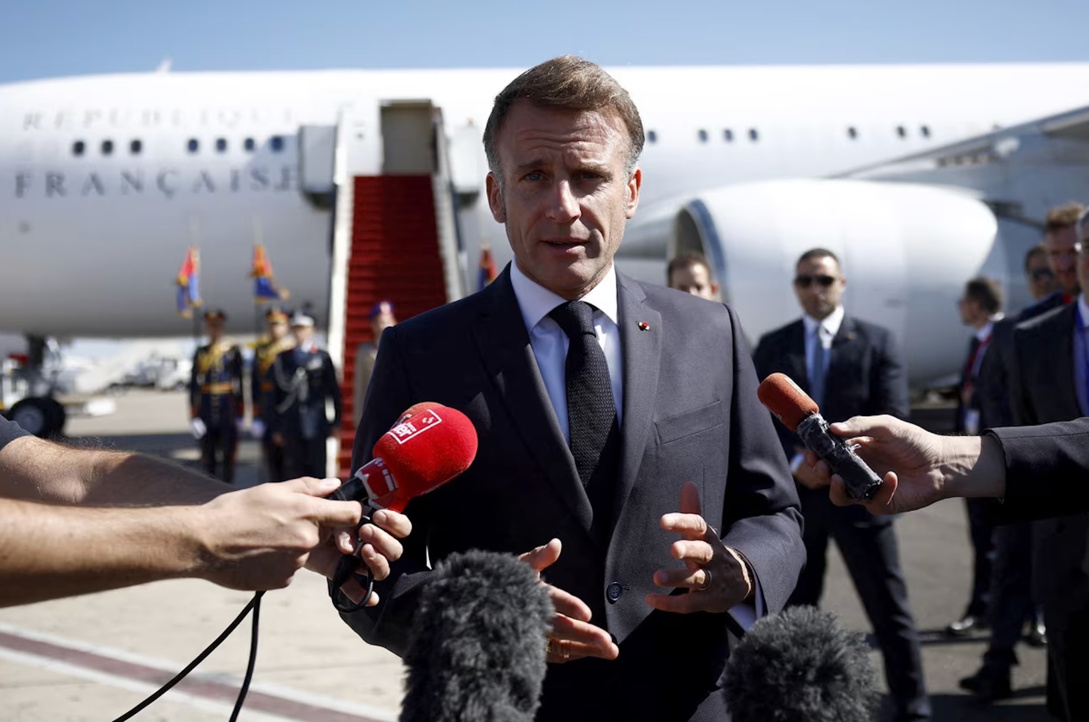 French President Emmanuel Macron speaks to the members of the media in Sharm el-Sheikh, Egypt, on Monday, October 13, 2025. | Yoan Valat/Reuters
