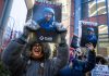 ICE Agents Placed on Leave After Fatal Shooting of Alex Pretti in Minneapolis Protesters gathered outside the office of Minnesota senator Amy Klobuchar on Monday, Jan. 26, 2026, following the shooting. | AFP viaGetty Images