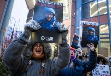 ICE Agents Placed on Leave After Fatal Shooting of Alex Pretti in Minneapolis Protesters gathered outside the office of Minnesota senator Amy Klobuchar on Monday, Jan. 26, 2026, following the shooting. | AFP viaGetty Images