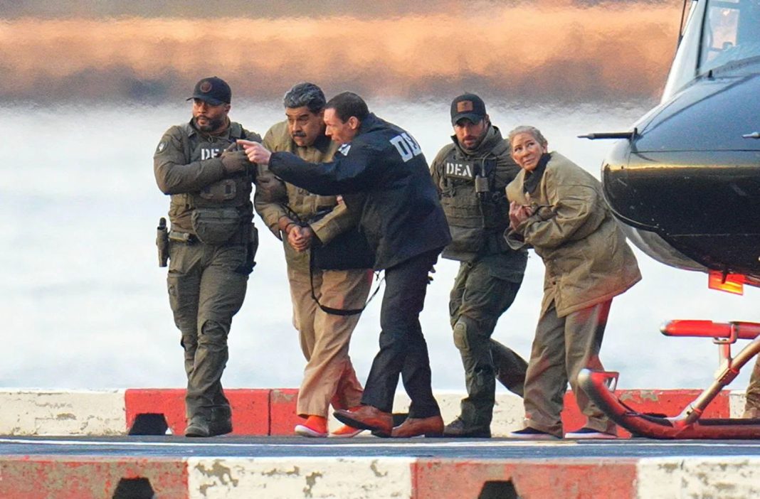 Venezuelan President Nicolás Maduro and his wife, Cilia Flores, enter federal custody after arriving in New York, where they pleaded not guilty before Judge Alvin Hellerstein in the Southern District of New York on Monday, January 5, 2026. They are seen here being escorted by U.S. federal agents after disembarking from a helicopter.