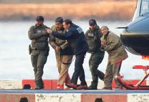 Maduro, Wife Plead Not Guilty in New York as Lawyers Challenge Legality of Their Capture Venezuelan President Nicolás Maduro and his wife, Cilia Flores, enter federal custody after arriving in New York, where they pleaded not guilty before Judge Alvin Hellerstein in the Southern District of New York on Monday, January 5, 2026. They are seen here being escorted by U.S. federal agents after disembarking from a helicopter.