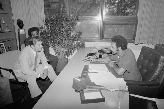 Republican presidential candidate Ronald Reagan listens to Jackson during a visit to Operation PUSH headquarters in August