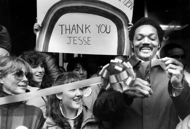 Jackson cuts a ribbon to open his campaign headquarters in Manchester, New Hamp