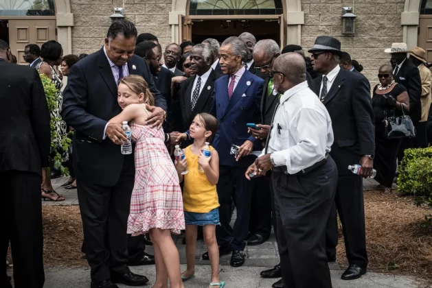 Jackson hugs a child in