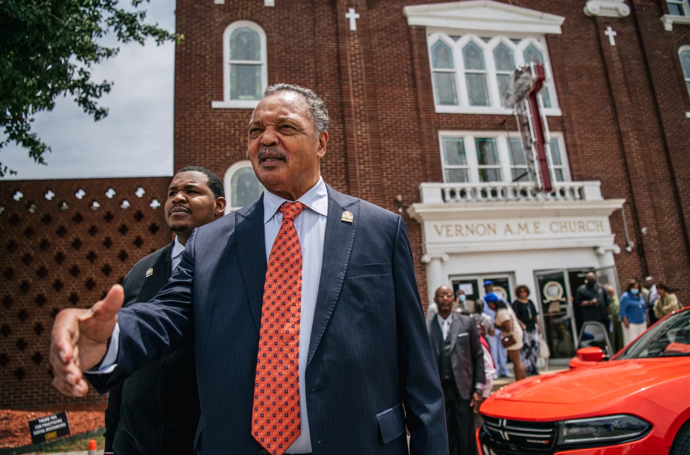 Jackson greets community residents before departing Vernon AME Church in Tulsa, Okla., on May 30, 2021. Brandon Bell / Getty Images