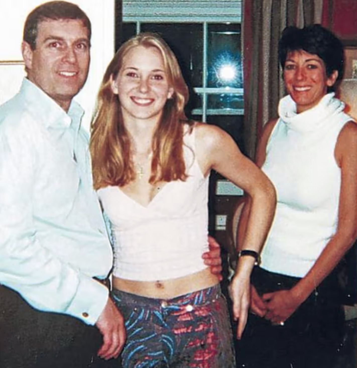 Virginia Giuffre (then Roberts) with then-Prince Andrew and Ghislaine Maxwell at his London home in a photo released with court documents.