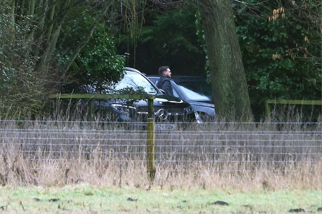 A man steps out of an unmarked car at the home of Andrew Mountbatten-Windsor in Sandringham, Norfolk, on Thursday, February 19, 2026. | Peter Nicholls / Getty Images