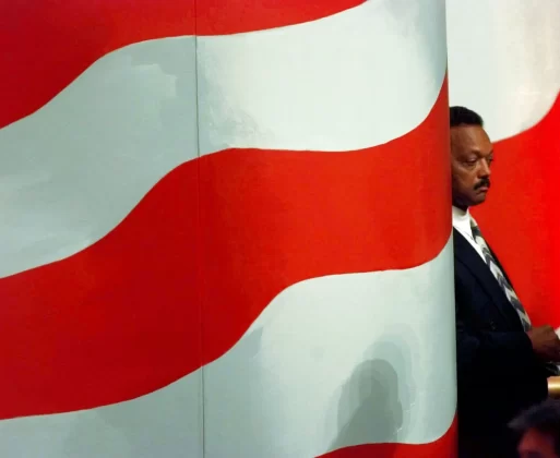 Jackson waits while son Jesse Jackson Jr. introduces him to delegates at the Democratic National Convention in Chicago, in August 1996. Ron Edmonds/AP