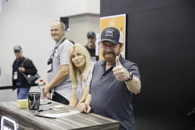 The actor and martial artist was also known for his support of conservative politics in the states - pictured here with President Bush at a school in Houston demonstrating an anti-drug programme sponsored by Norris