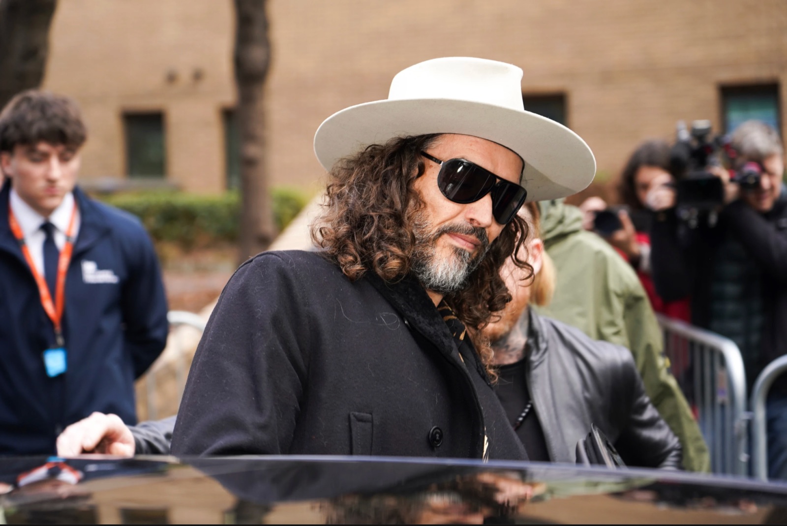 Russell Brand leaves Southwark Crown Court, in London, Tuesday, Feb. 24, 2026. | AP Photo/Alberto Pezzali