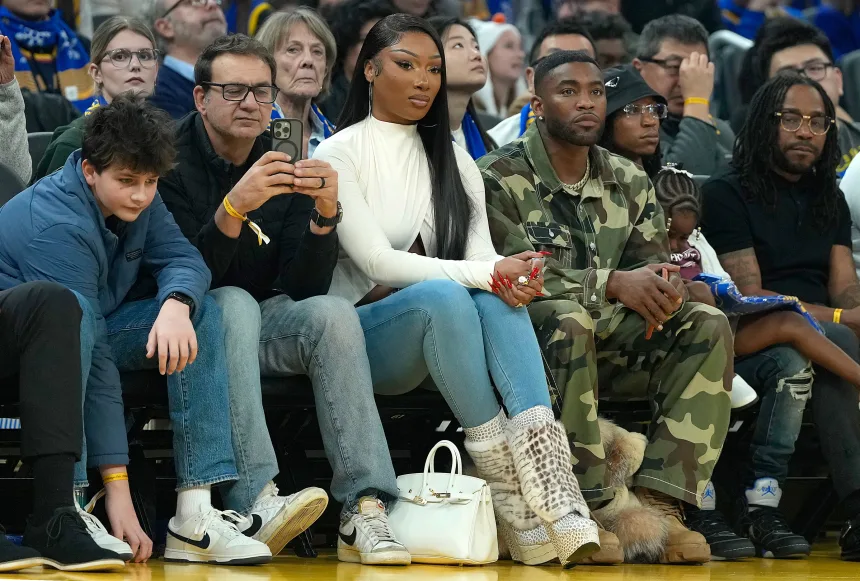 Megan sits courtside during the Dallas Mavericks and Golden State Warriors game on Christmas Day in San Francisco, California. Thompson only had 7 points that night. 