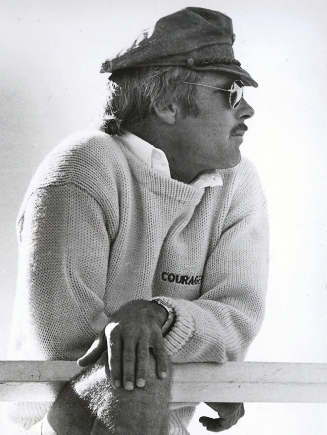 The name of Turner's winning yacht, Courageous, is emblazoned on his sweater. TBS