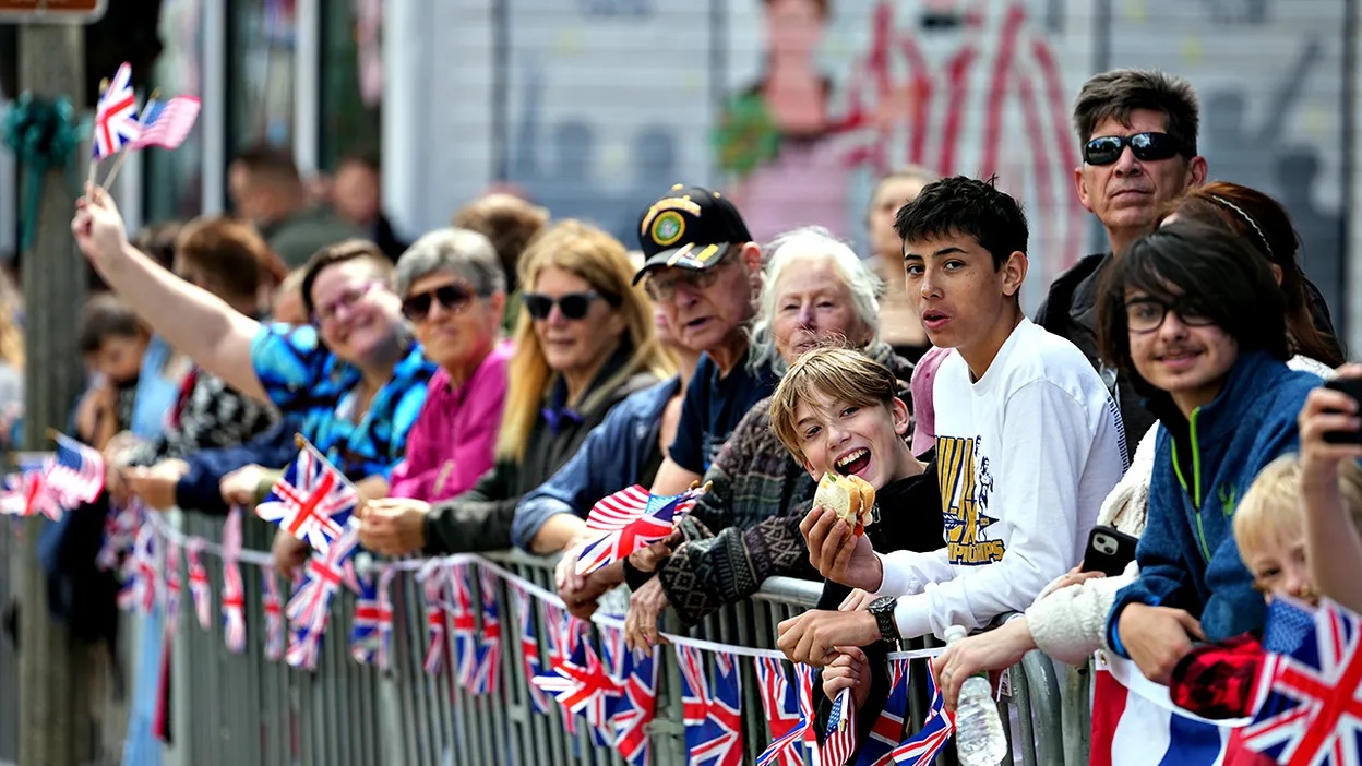 People arrive before Britain's King Charles III and Queen Camilla attend a parade in Front Royal, Va., Thursday, April 30, 2026.