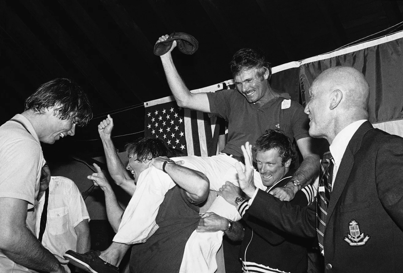 Turner is carried off by his sailing crew after they won the America's Cup, a prestigious sailing competition, in 1977. J. Walter Green/AP