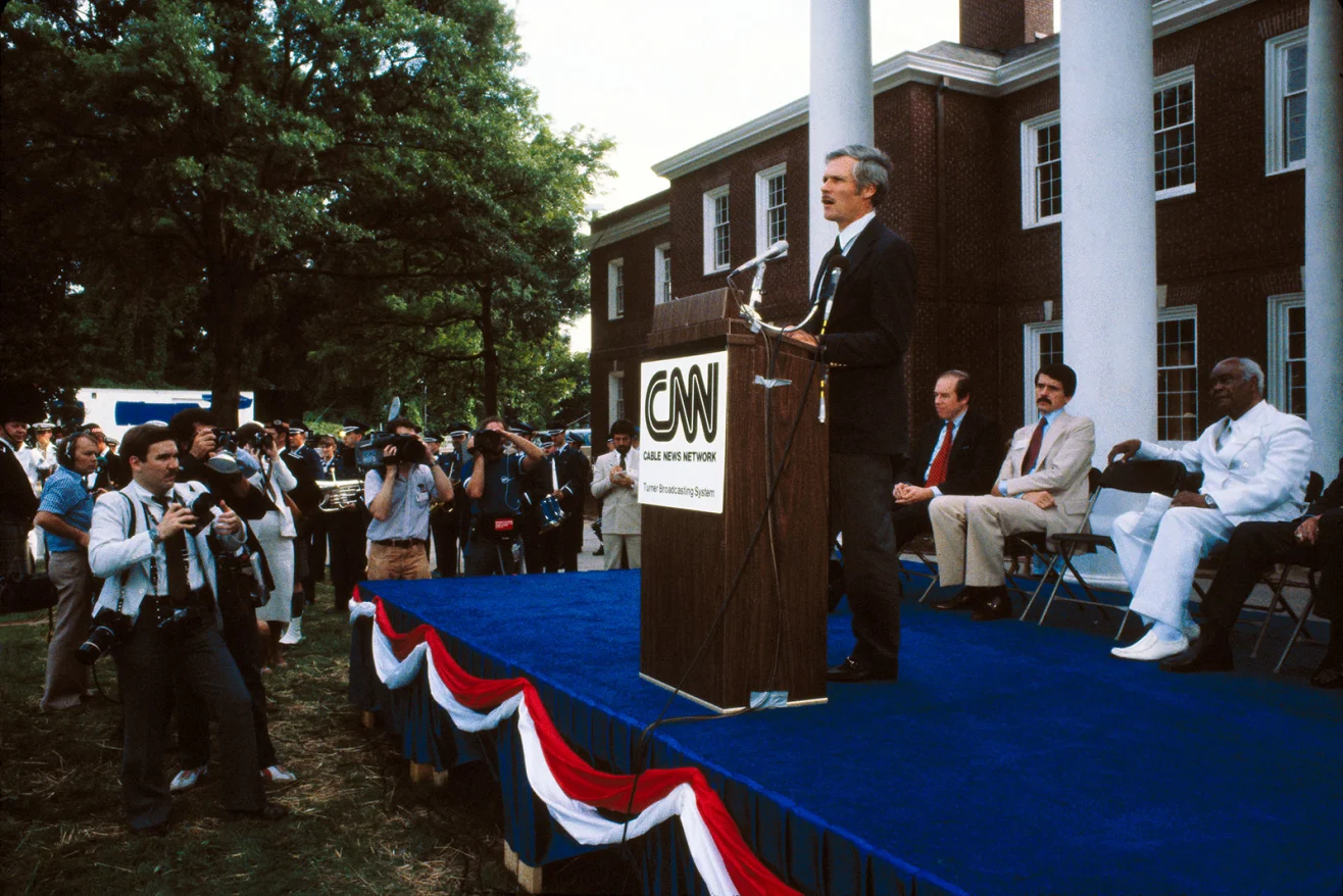 Turner speaks outside of CNN's Techwood Campus as he promoted the launch of the 24-hour news network in 1980. R. Cotton Alston, Jr/CNN