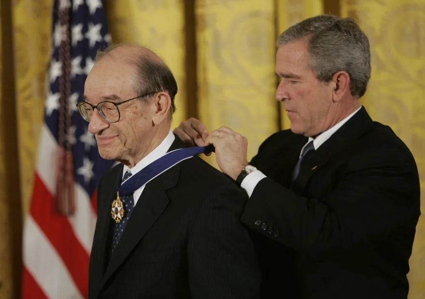 President George W. Bush presents the Presidential Medal of Freedom to Federal Reserve Chairman Alan Greenspan in Washington, on November 9, 2005.